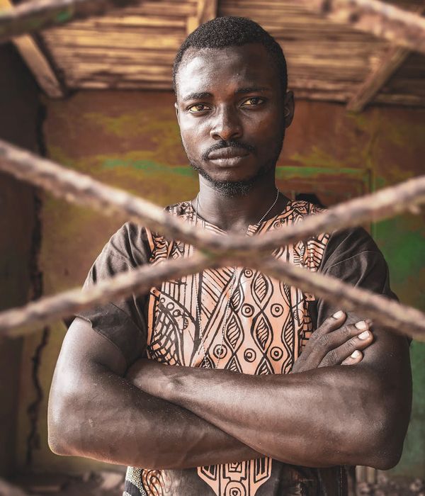 Man in a calm, focused state after a workout, looking into the distance.